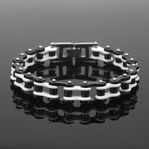 Macro detail of bicolored motorcycle chain bracelet with polished steel and black finish