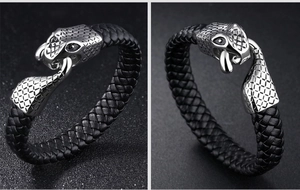 Detailed macro shot of the black braided leather bracelet with a silver snake clasp