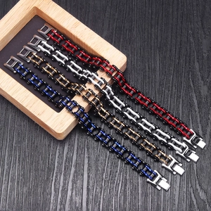 Men's stainless steel motorcycle bike chain bracelets in four colors on wood tray