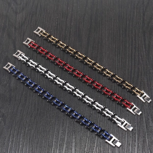 Detailed view of four motorcycle chain style stainless steel bracelets in varied colors