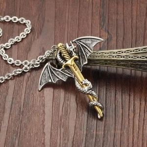 Men's retro fantasy dragon wing and gold sword pendant necklace on a wooden background