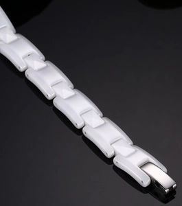 Minimalist white ceramic chain bracelet with silver metal clasp on black background