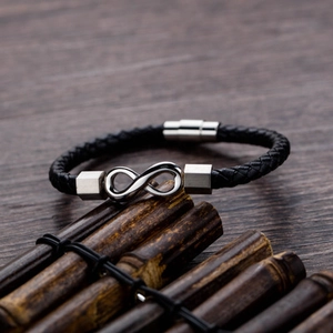 Braided black leather bracelet with silver infinity symbol and magnetic metal clasp