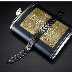 Detail of black stainless steel watch link bracelet with a fold-over clasp for men