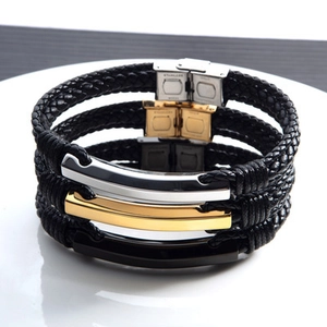 Lot de trois bracelets en cuir tressé noir avec plaques polies en or, argent et noir