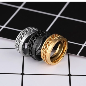 Close-up of three-color rotatable chain rings with engraved Roman numerals on steel