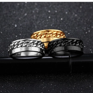 Detailed view of three rotating steel rings with chain inlay and Roman numerals