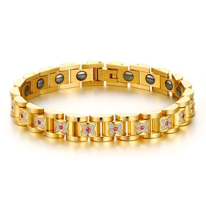 Detail of gold magnetic bracelet showing pink zircon flower design and stainless steel stamp