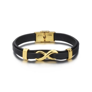 Detail showing the polished golden infinity symbol on a black leather bracelet with steel clasp