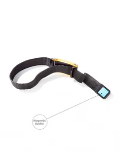 Detail of black mesh stainless steel bracelet with golden plate and magnetic clasp