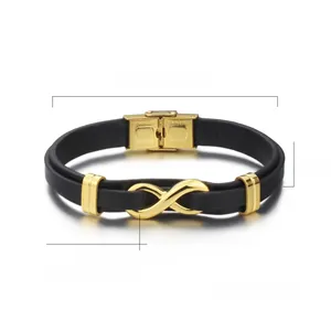 Detail of infinity symbol charm on black leather bracelet with IP gold plating finish