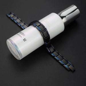 Men's magnetic therapy bracelet in matte black and blue titanium steel finish