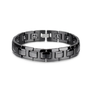 Macro detail of men's magnetic ceramic bracelet with polished black rectangular links