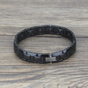 Mens magnetic therapy bracelet with black ceramic links and polished stainless steel clasp