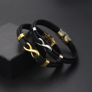 Detail of infinity symbol magnetic clasps on double-layer black leather men's bracelets