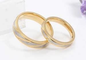 Minimalist gold and silver titanium steel couple rings with a brushed texture finish