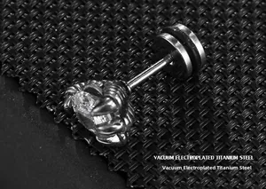 Macro shot of silver dragon claw stud earring with round clear zircon on black texture