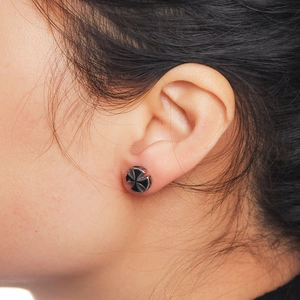Titanium steel crown zircon earring with black punk cross design on ear model