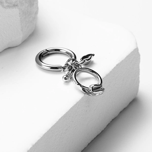 Minimalist silver stainless steel hoop earrings featuring a serpent pendant and ball drop