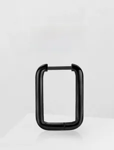 Macro shot of minimalist black titanium U-shaped hoop earring with polished mirror finish