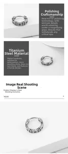 Detail of vintage silver titanium steel earrings with engraved textures and mirror finish