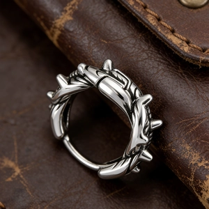 Macro shot of silver stainless steel thorn ring with gothic punk design details