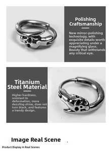 Detailed macro view of skull engraved titanium steel earrings with mirror polished finish