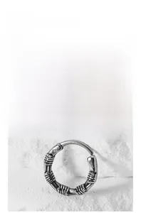 Detailed view of silver hoop earring with vintage textured metallic wire wrapping