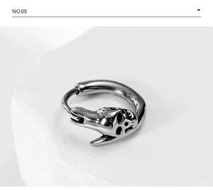 Detailed macro view of vintage silver steel skull earring with gothic rock texture