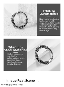 Detailed view of vintage silver titanium steel hoop earring with wire wrap texture