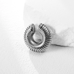 Punk style silver stainless steel wolf tooth earrings with textured spiral design