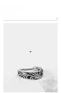 Detailed relief patterns on vintage titanium steel jewelry with a matte silver finish