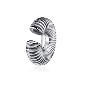 Vintage punk silver stainless steel ear cuff with textured spiral pattern on white background