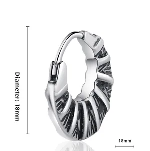 Detailed view of 18mm vintage silver cross earrings with engraved spiral texture