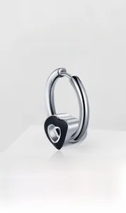 Detailed macro view of heart hoop earring with silver polished finish and black enamel