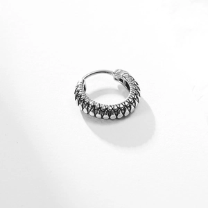 Retro silver titanium steel hoop earring featuring intricate relief drop-shaped textures