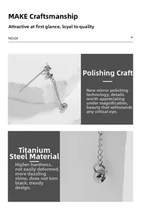 Macro shot of mirror-polished titanium steel earrings with chains and spherical charms