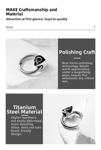 Detail of mirror polished titanium steel earring featuring a black heart drop charm
