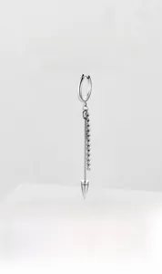 Detail of silver stainless steel cross earring with chain and cone spike pendant
