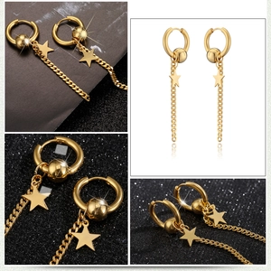 Detailansicht goldener Quastenohrringe mit Sternanhänger und eleganter Panzerkette
