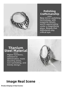 Detailed close-up of vintage titanium steel earrings with intricate engraved floral patterns