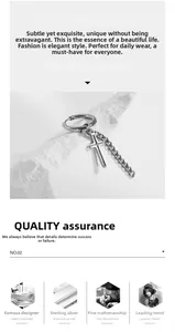 Detail of cross pendant chain earring made of durable titanium steel with silver finish