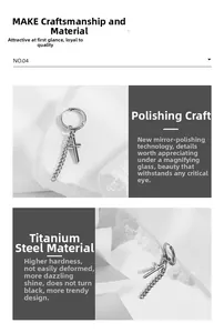 Detailed close-up of mirror-polished titanium steel hoop earring with cross and chain