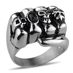 Detailed view of punk skull ring with central black gemstone in stainless steel finish