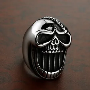 Macro shot of silver skull bottle opener ring with gothic brushed stainless steel finish