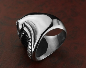 Detailed macro view of punk stainless steel skull ring with alien xenomorph biomechanical design