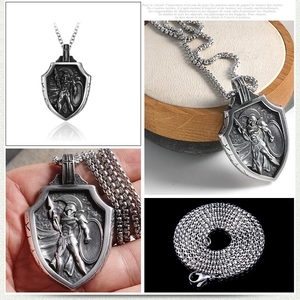 Macro shot of retro stainless steel Spartan shield pendant with detailed warrior relief