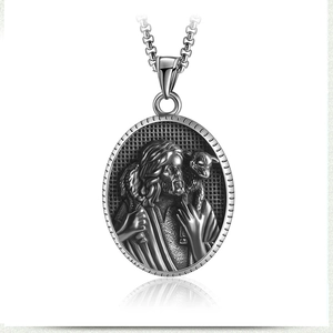 Macro view of vintage silver warrior pendant with relief engraving and box chain
