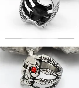 Close-up of punk skeleton ring with red rhinestone eyes and Gothic claw design