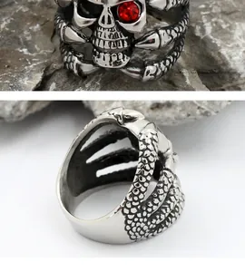Gothic punk skull ring in silver steel with red rhinestone eyes and bone texture detail